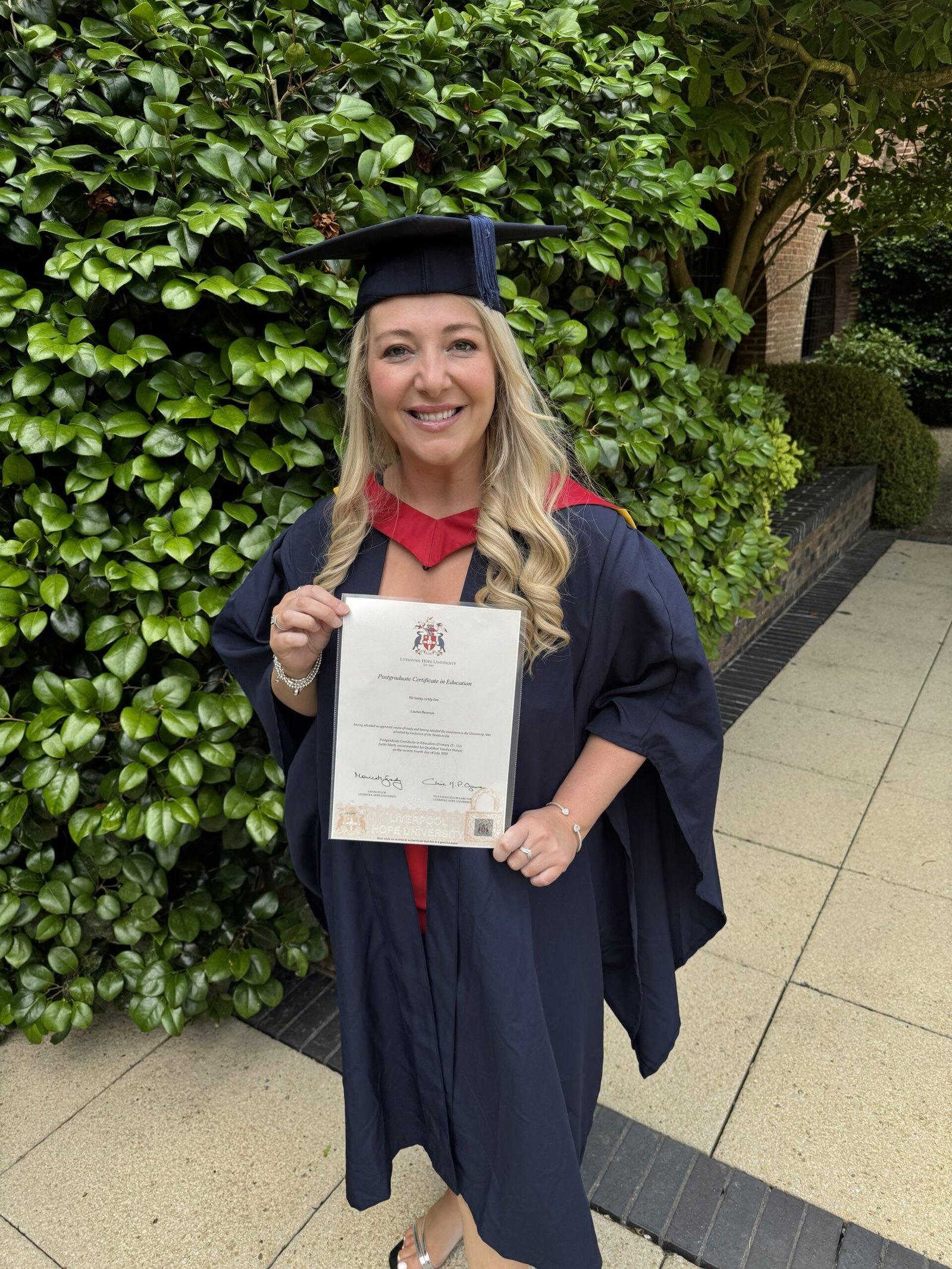 Lauren Waterworth with her Postgraduate Certificate in Education (PGCE)